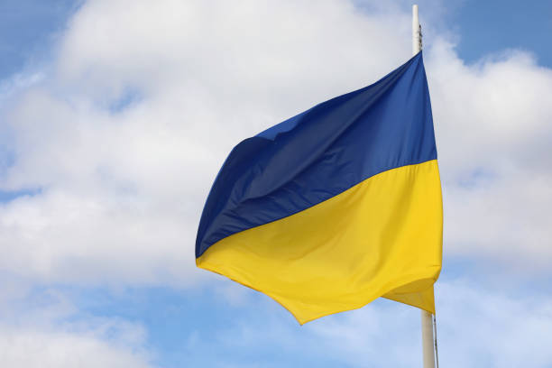 istock ukrainian flag on blue sky with blue and yellows colors 1431604328