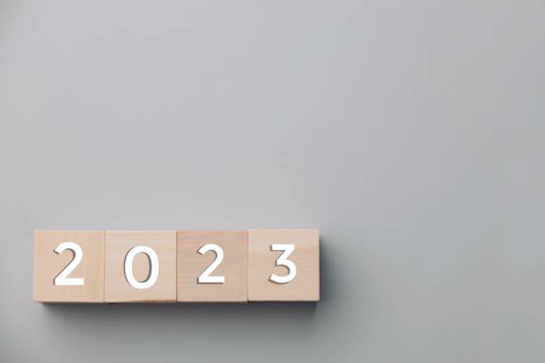 istock 2023 white numbers on wooden dice on gray background 1431605219