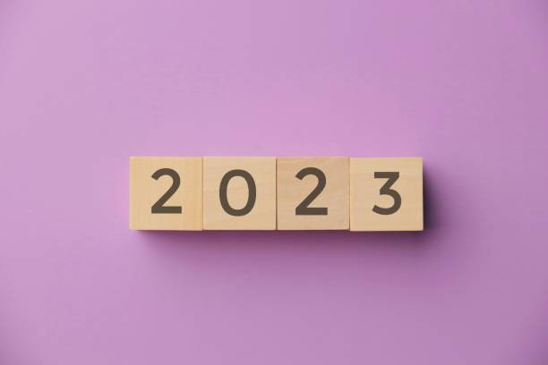 istock numbers 2023 on a purple background, happy new year concept 1431605237