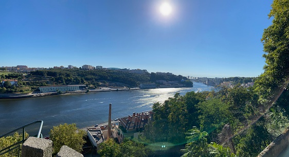 Douro river scene in Porto city skyline on a blue sunny sky
