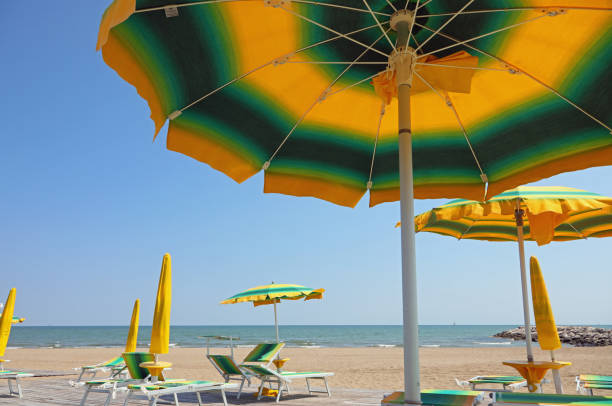 istock colored sun umbrellas on the sandy beach by the sea 1431610634