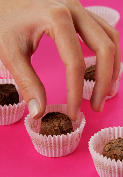 istock Hand chocolate sweet party cupcake 1431610950