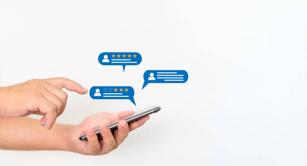 istock User give rating to service experience on online application with smartphone, Man holding smartphone and chat with people ,Customer service experience and satisfaction survey in write wall background 1431612555
