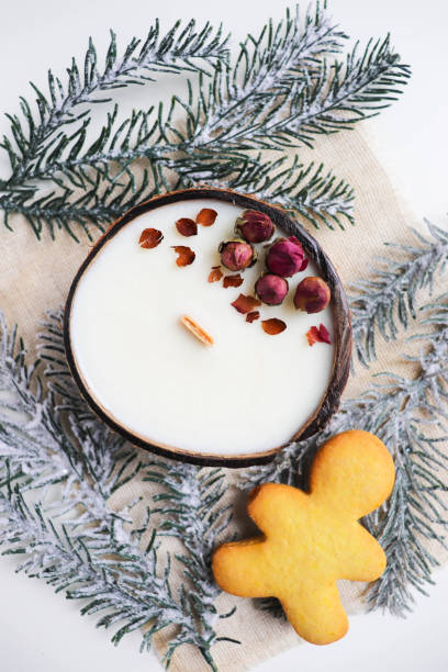 istock christmas candle in coconut and fir branches 1431620902