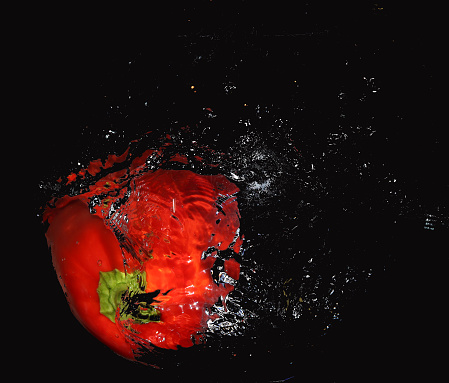 Red pepper in splash