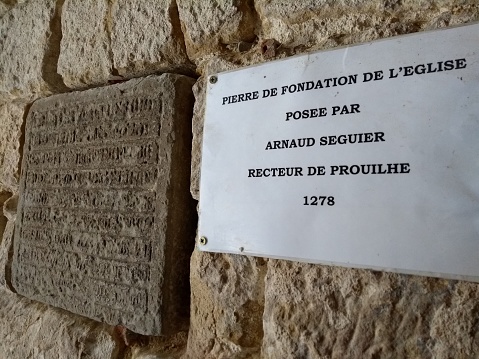 Church of Our Lady of the Assumption church built 1278 foundation stone & notice, Fanjeaux, Aude, Occitanie, France: 21 Jul 2018