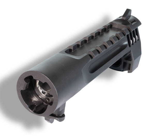 istock Shadow behind a slide and barrel for a pistol from the chamber side 1431633741