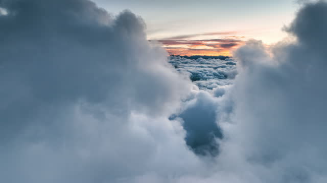 A spectacular sea of clouds can be seen in the gap between the two clouds