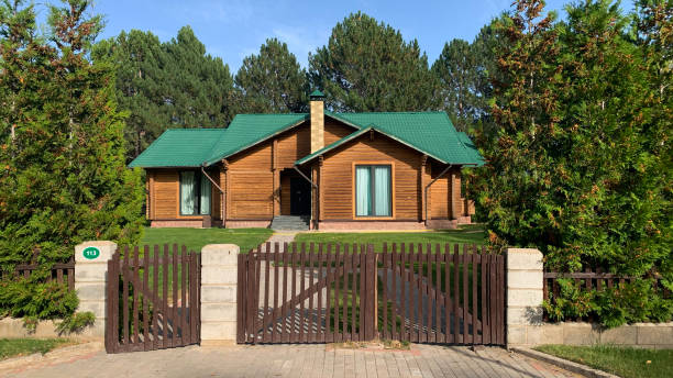 istock A modern neat cottage surrounded by trees in a daylight 1431652530