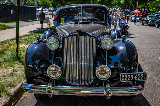 Falcon Heights, MN - June 18, 2022: High perspective front view of a 1938 Packard 1607 V12 Club Sedan  at a local car show.