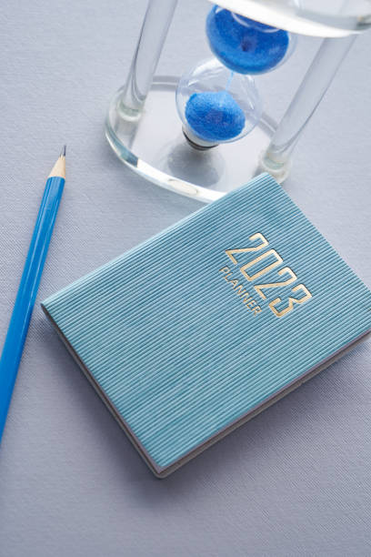 istock 2023 planner and pencil with hourglass 1431657627