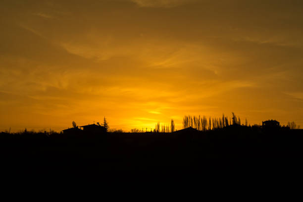 istock Sunset over farm in the field 1431657879