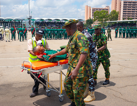 A member of Nigeria Army was rush to the medical tent after he almost collapse under an intensed sun on the parade ground during 62nd independence day celebration at eagle square, Abuja, Nigeria.