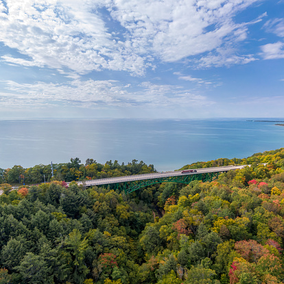 Drone photo of the Cut River Bridge on US 2 highway in the fall with Lake Michigan in the background