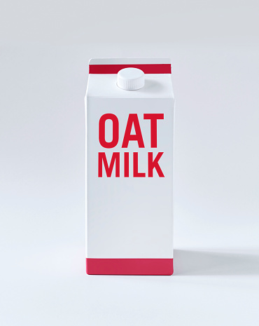 Oat milk carton on white background