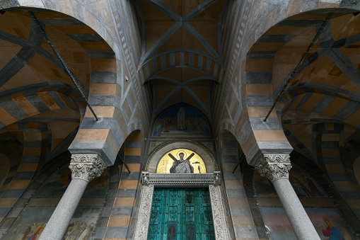 Amalfi, Italy - May 28, 2021: Entrance to the Apostle Saint Andrew, Roman Catholic church in Amalfi, Italy.