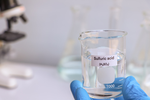 sulfuric acid in glass, chemical in the laboratory and industry, corrosive chemical