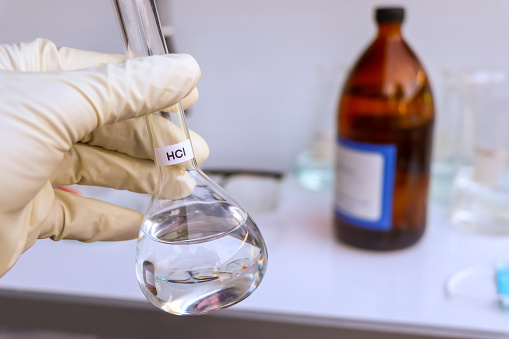 hydrochloric acid in glass, chemical in the laboratory and industry, corrosive chemical