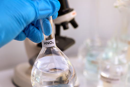 nitric acid in glass, chemical in the laboratory and industry, corrosive chemical