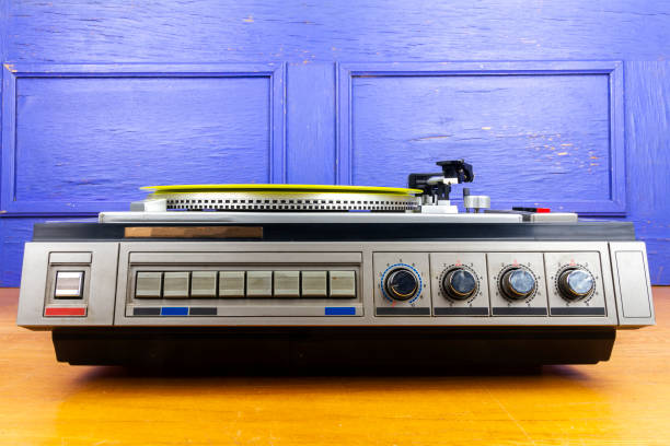 istock Vintage turntable vinyl record player with yellow vinyl 1431694942