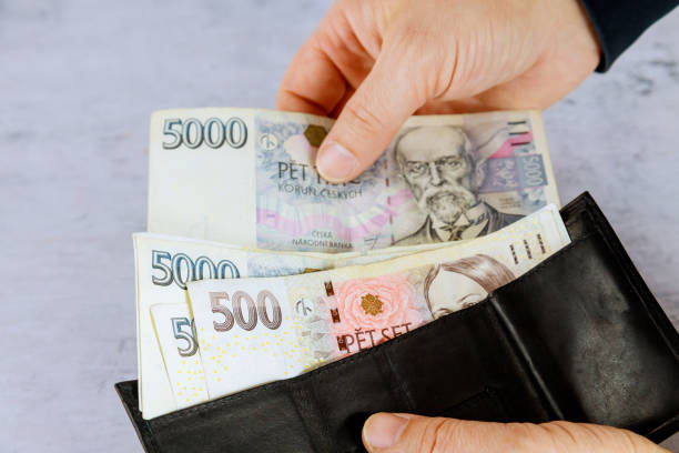 Czech Republic banknotes with man counts Czech koruna in his wallet