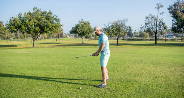 istock man playing golf game on green grass, sport 1431706109