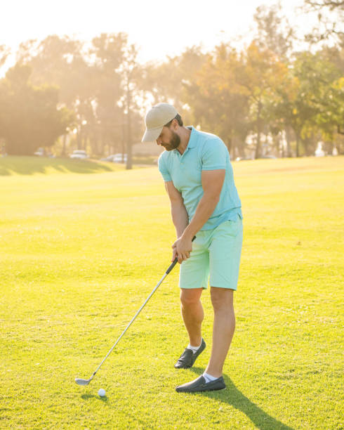 istock playing golfer in cap with golf club, recreation 1431706133