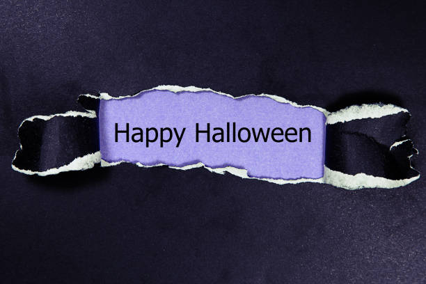 istock Happy Halloween written under torn paper. 1431707630