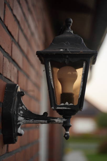 istock Old street lamp on the wall with a modern lamp 1431710156
