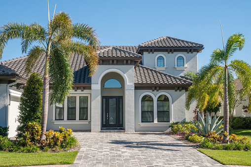 Sarasota, FL, US-September 26, 2022: Exterior of newly built modern luxury house in suburban neighborhood.