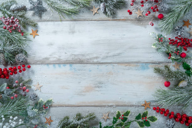 istock Christmas background frame with fir tree, holly, stars with snow 1431725708