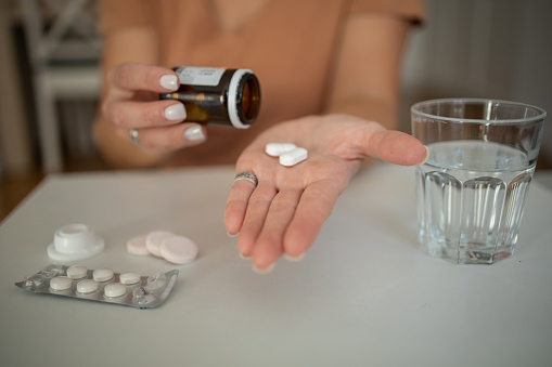 Woman taking pill