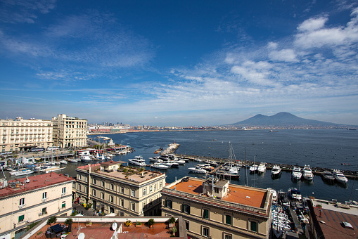 The city of Naples. You can see the harbour, the bay of Naples and in the background the vulcano Vesuvius.