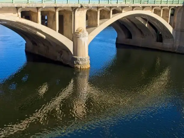 Basiliere bridge crossing the Merrimack river between Bradford and Haverhill Massachusetts. The historic Basiliere bridge built in 1925 is a bascule style bridge and as of 2022 considered deficient is is scheduled for replacement in 2025.