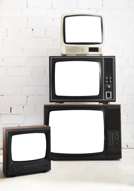 istock Four vintage white screen televisions with a white brick background. 1431735064