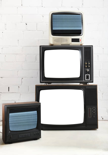 istock Four vintage white screen televisions with a white brick background. 1431735072