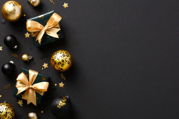 istock Chic Christmas black background with gift boxes, golden and black balls, decorations, confetti. Luxury Xmas banner mockup, New Year greeting card template, cover 1431735393