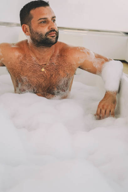 istock man enjoying a bath with foam and bubbles 1431739100