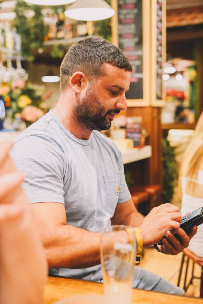 istock Man sitting in a bar having a good time 1431739112