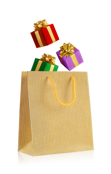 istock multicolored gift boxes fall into a golden bag. isolated on a white background 1431739310