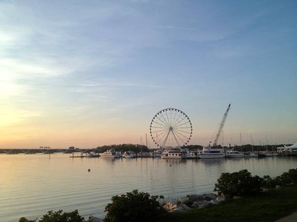 istock Sunset over the water with a Ferris wheel 1431739352