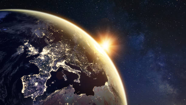 Sunrise on planet Earth viewed from space with city lights in Europe showing connections between European countries. Elements from NASA. Technology, global communication, world, energy, electricity. stock photo