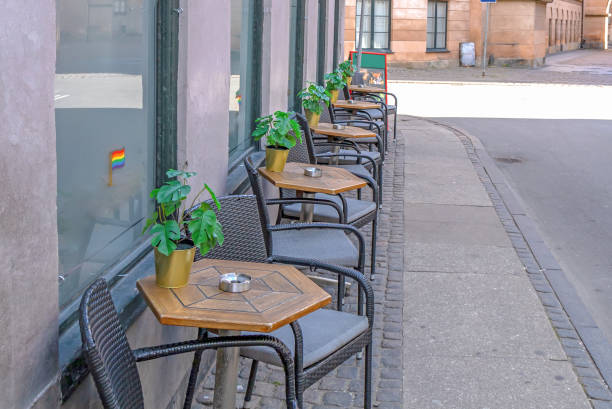 istock Cozy street cafe with empty tables on a summer day. 1431742928