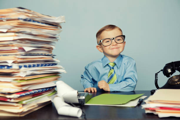 istock Young Boy Accountant Wearing Glasses at Office Desk 143174481