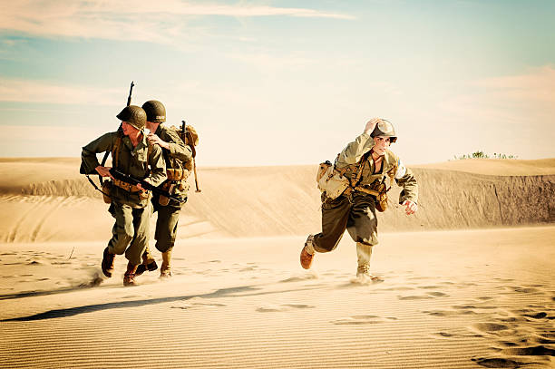 istock WWII Medic and Soldiers Running from Enemy Fire 143174491