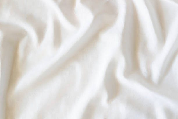 istock White crumpled linen fabric texture background. Natural linen organic eco textiles canvas background. Top view 1431746356