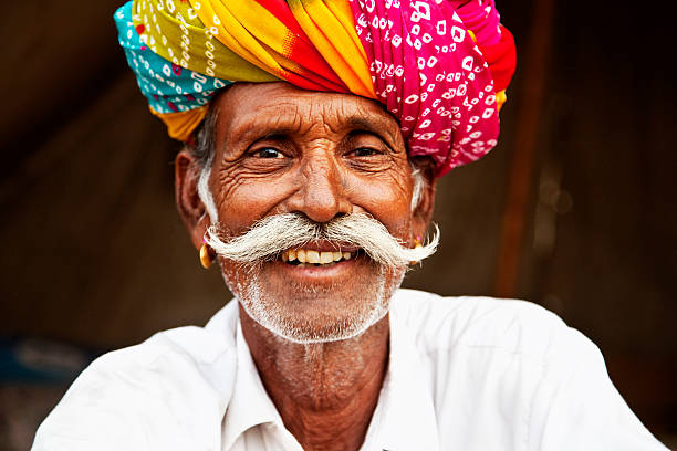 senior man with colorful turban, cattle fair in Pushkar, Rajasthan, India
