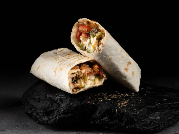 istock Two pieces of shaverma served on black stone 1431748757