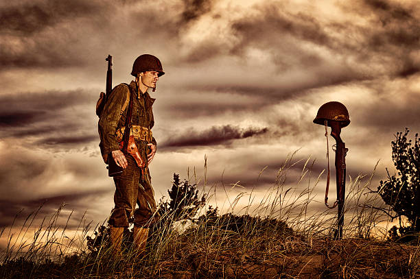 istock WWII Soldier Honoring Fallen Friend 143174922