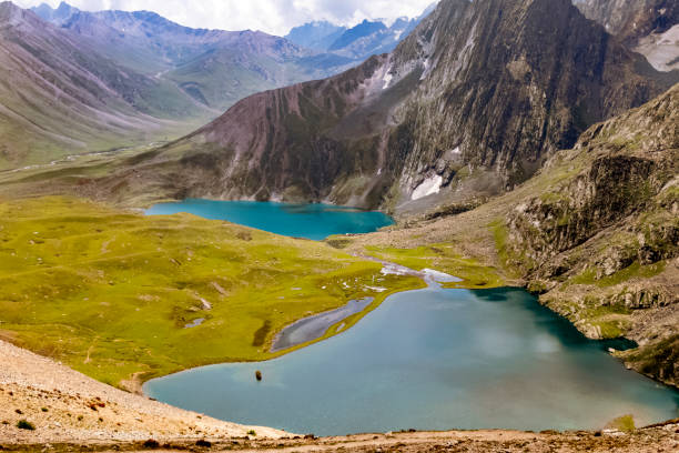 istock Beautiful mountain scenery. River, valley, snow, blue sky, white clouds. In-depth trip on the Sonamarg Hill Trek in Jammu and Kashmir, India 1431753323